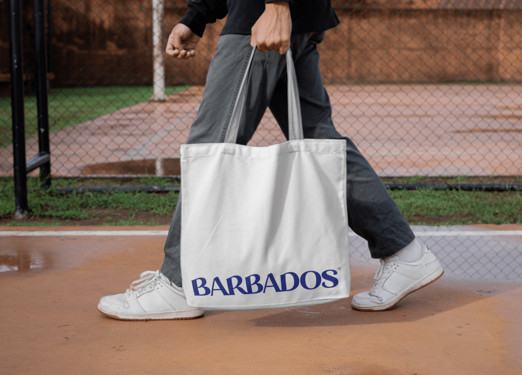 man carrying tote bag with new barbados logo